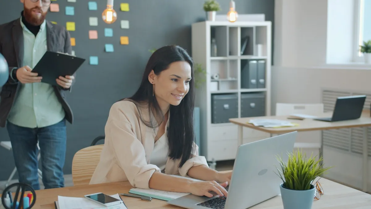 Professional woman and colleague in office
